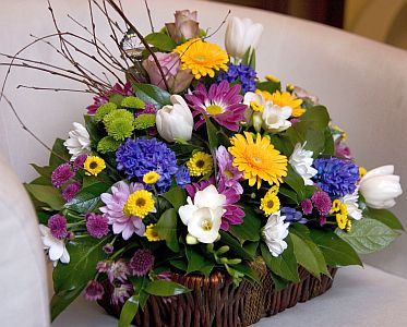 Spring arrangement made of chrysanthemum, germini, hyacinthus, tulips, santini,freesia, roses, etc.